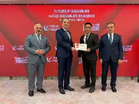 Erbakan'dan Bayraktaroğlu'na Üstün Başarı Ödülü